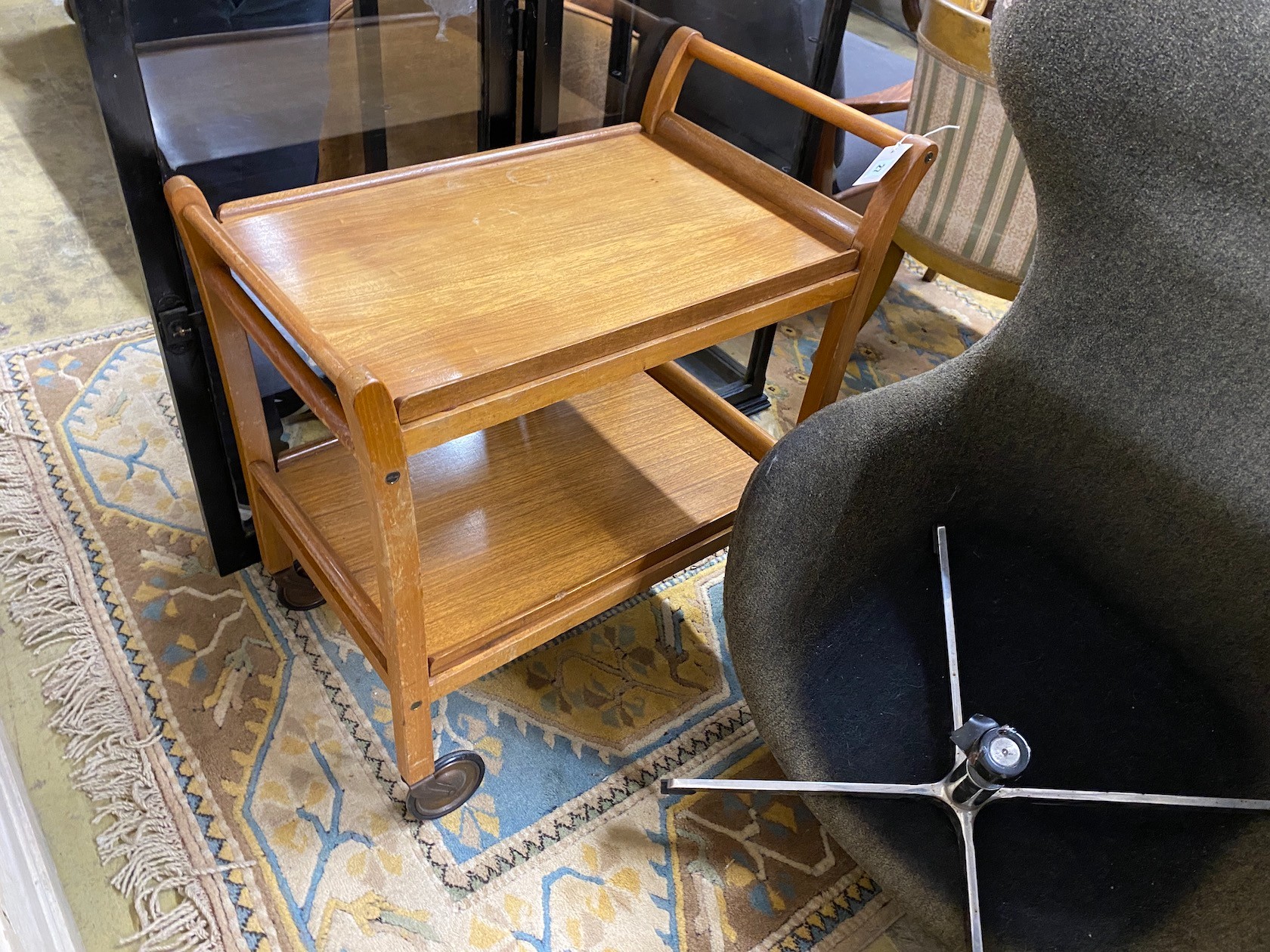 A mid century tray top teak two tier tea trolley, width 42cm, depth 65cm, height 73cm